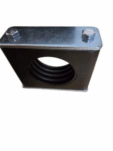 Close-up of a metal mounting bracket with two hex bolts on a steel surface against a red background